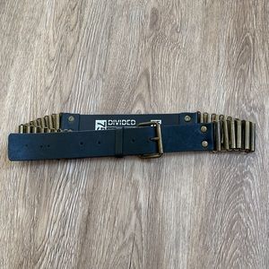 Divided leather belt with brass details .